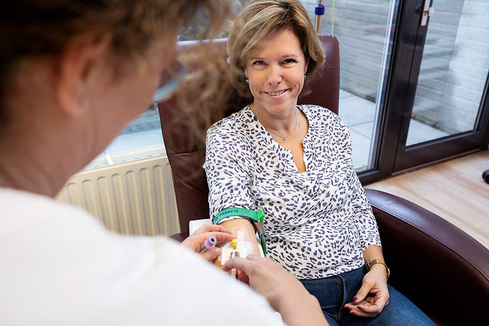 Patient in the treatment chair at Newmedix during a blood draw